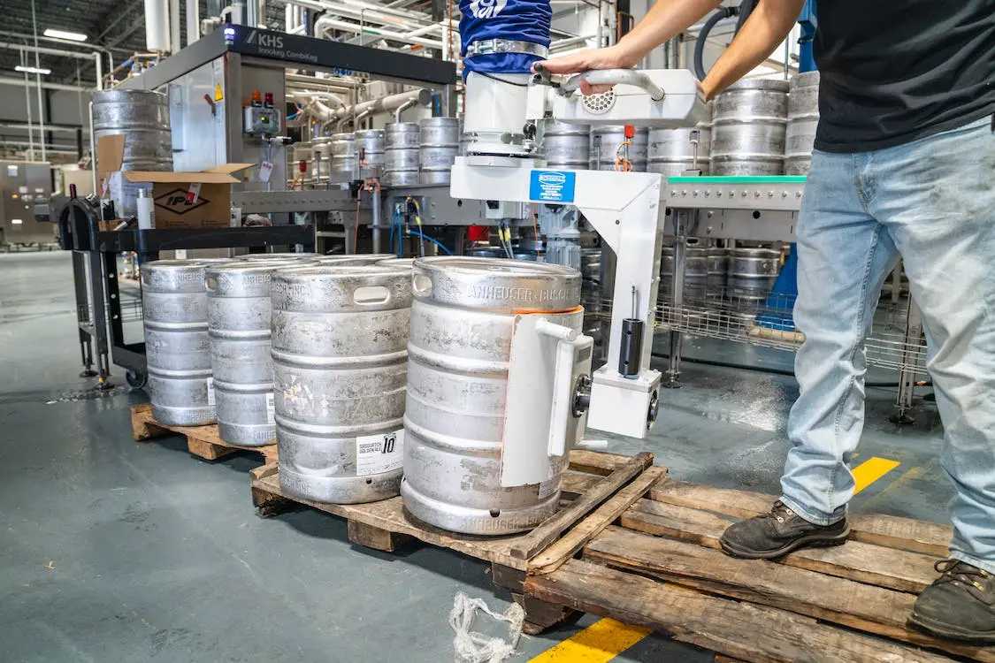 A Man Transporting Stainless steel Keg Container